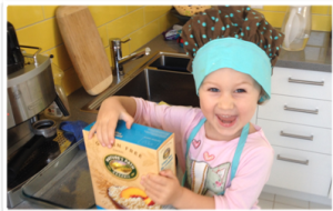 kid chef enjoying food