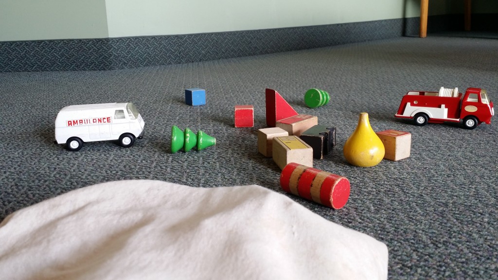 Stress of toys on ground with toy ambulance